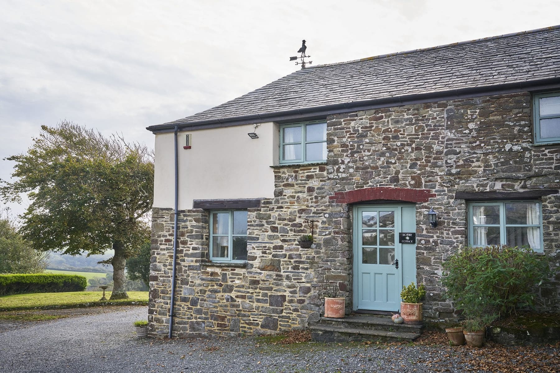 Jasmine Cottage exterior, stone barn conversion at Woodlands Manor Farm, Bude