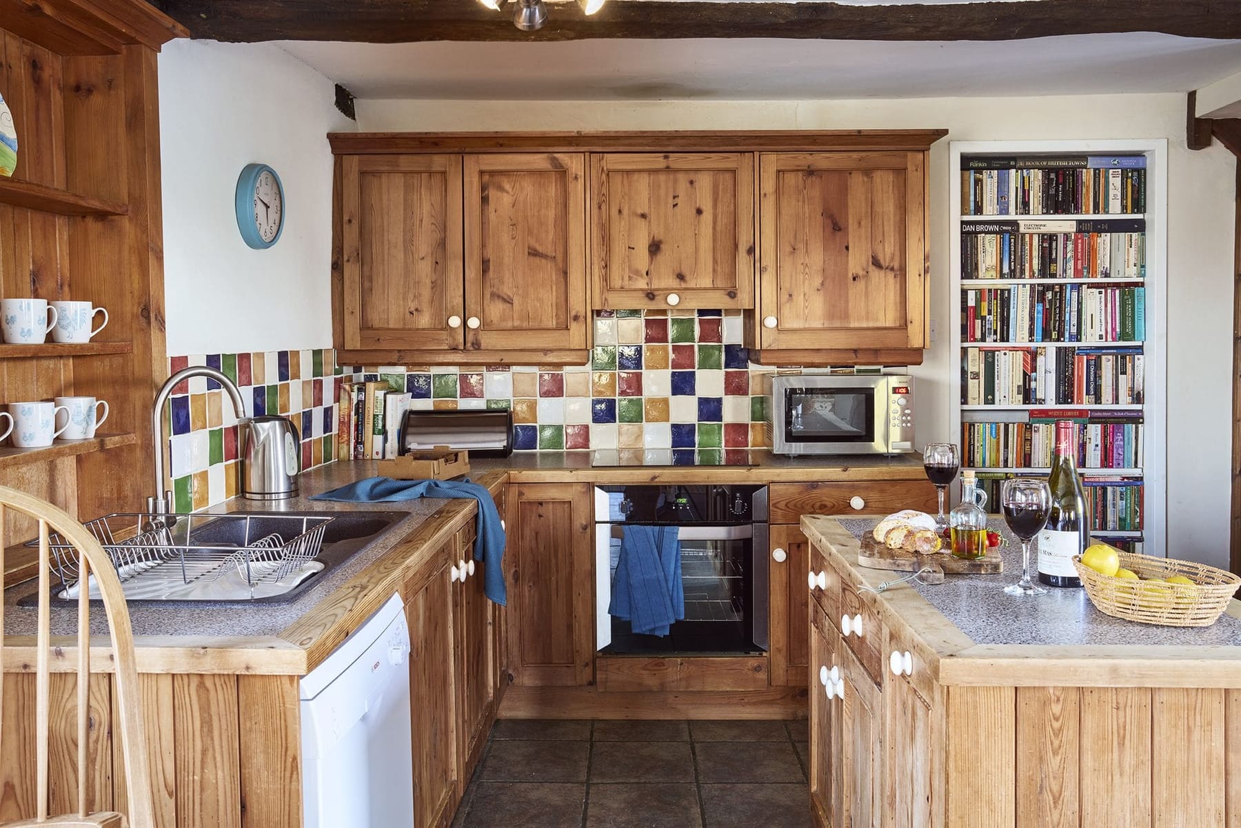 Secret bookcase door in Jasmine Cottage's ground-floor kitchen connecting to Lavender