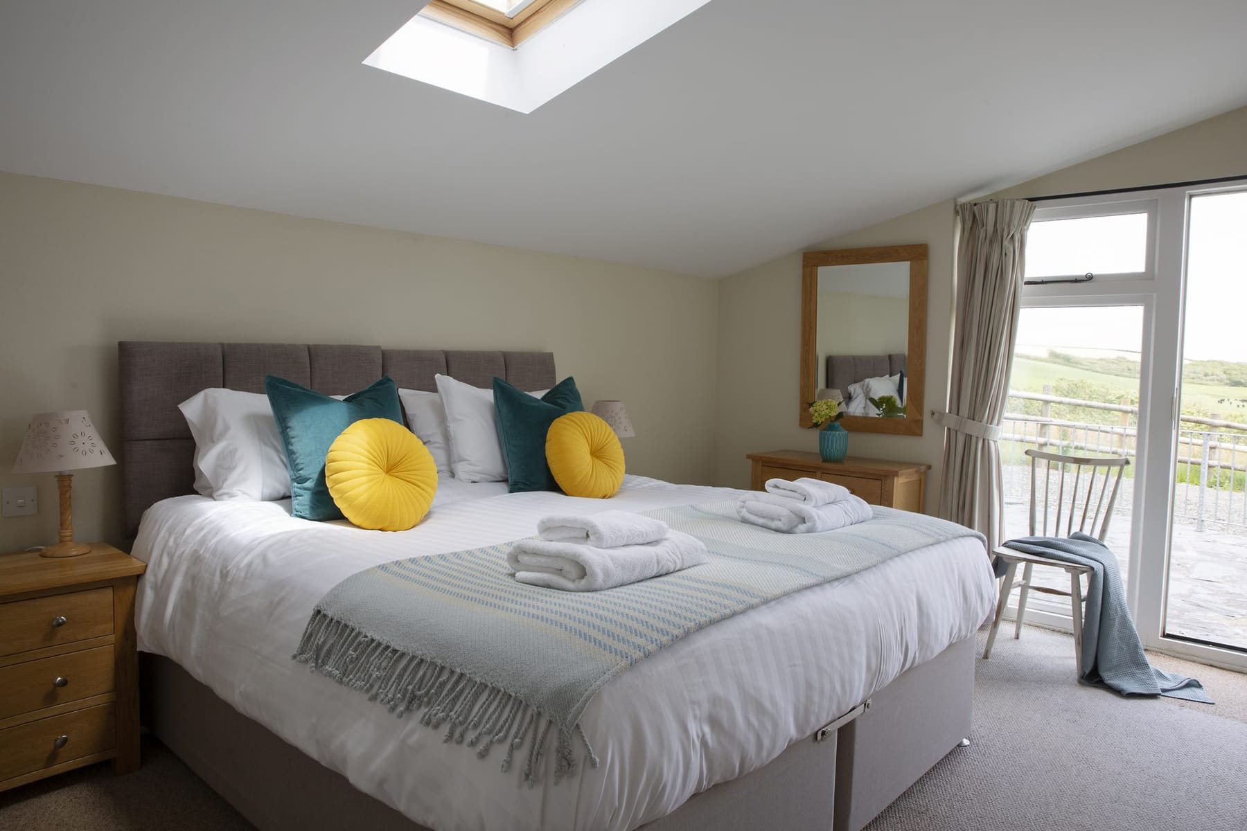 Master bedroom at The Stables with patio doors