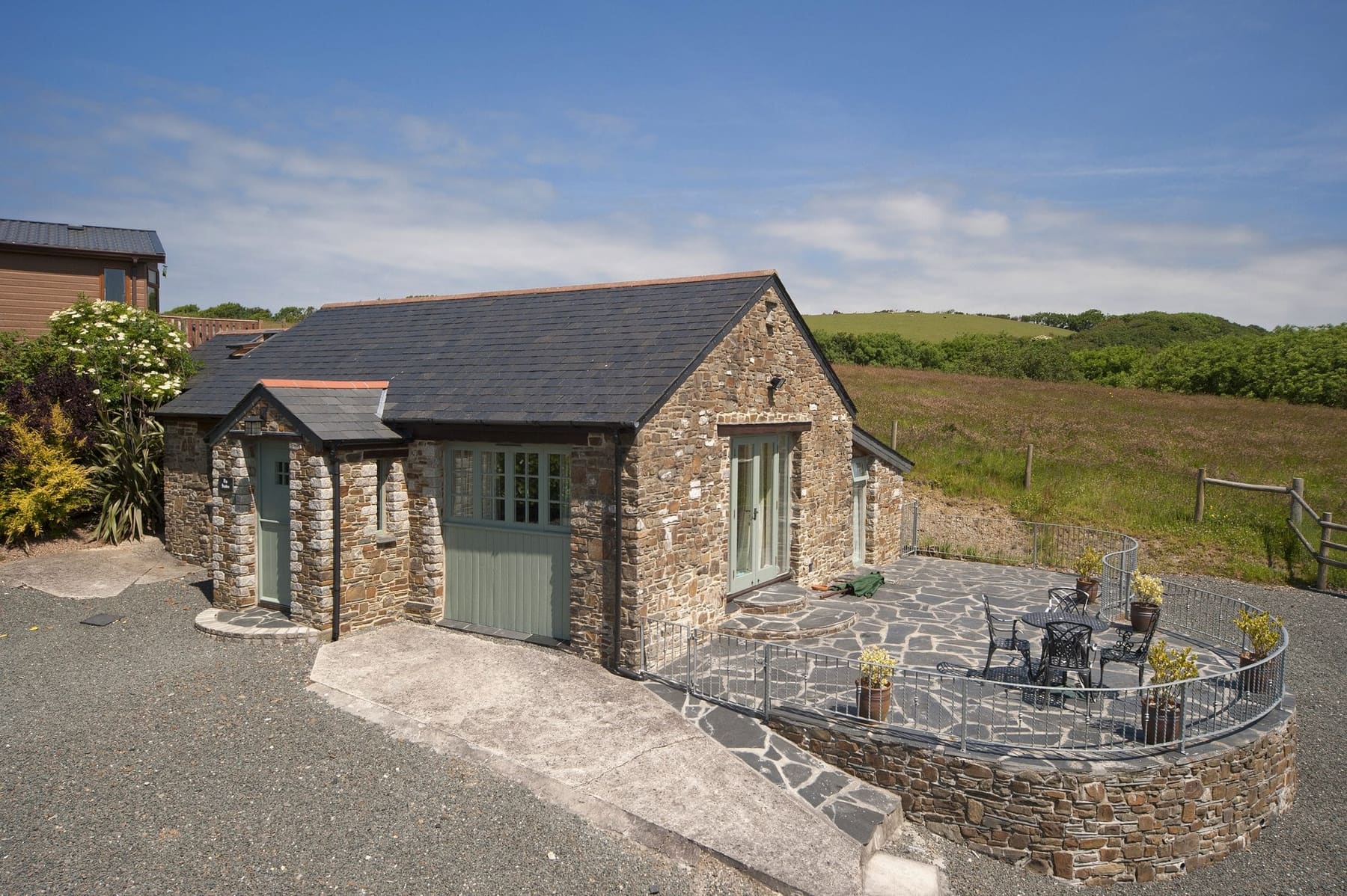 The Stables exterior with its stone patio
