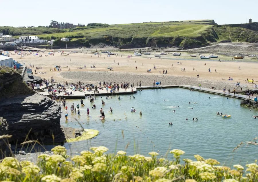 Swimmers enjoying Bude Sea Pool at Summerleaze Beach