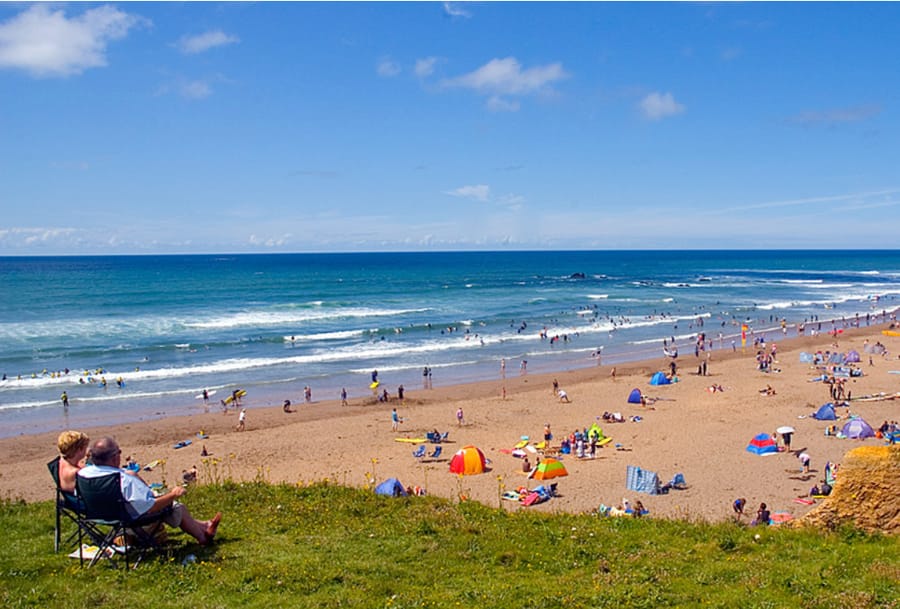Families on the golden sand at Summerleaze Beach, Bude in summer