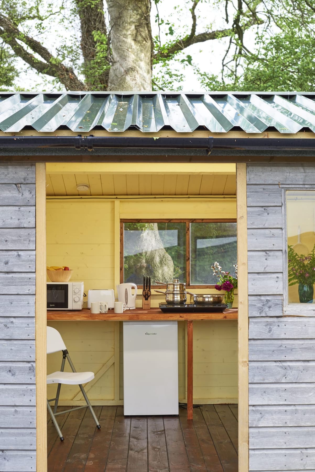 Dining cabin at Budhyn looking out to the yurt and meadow