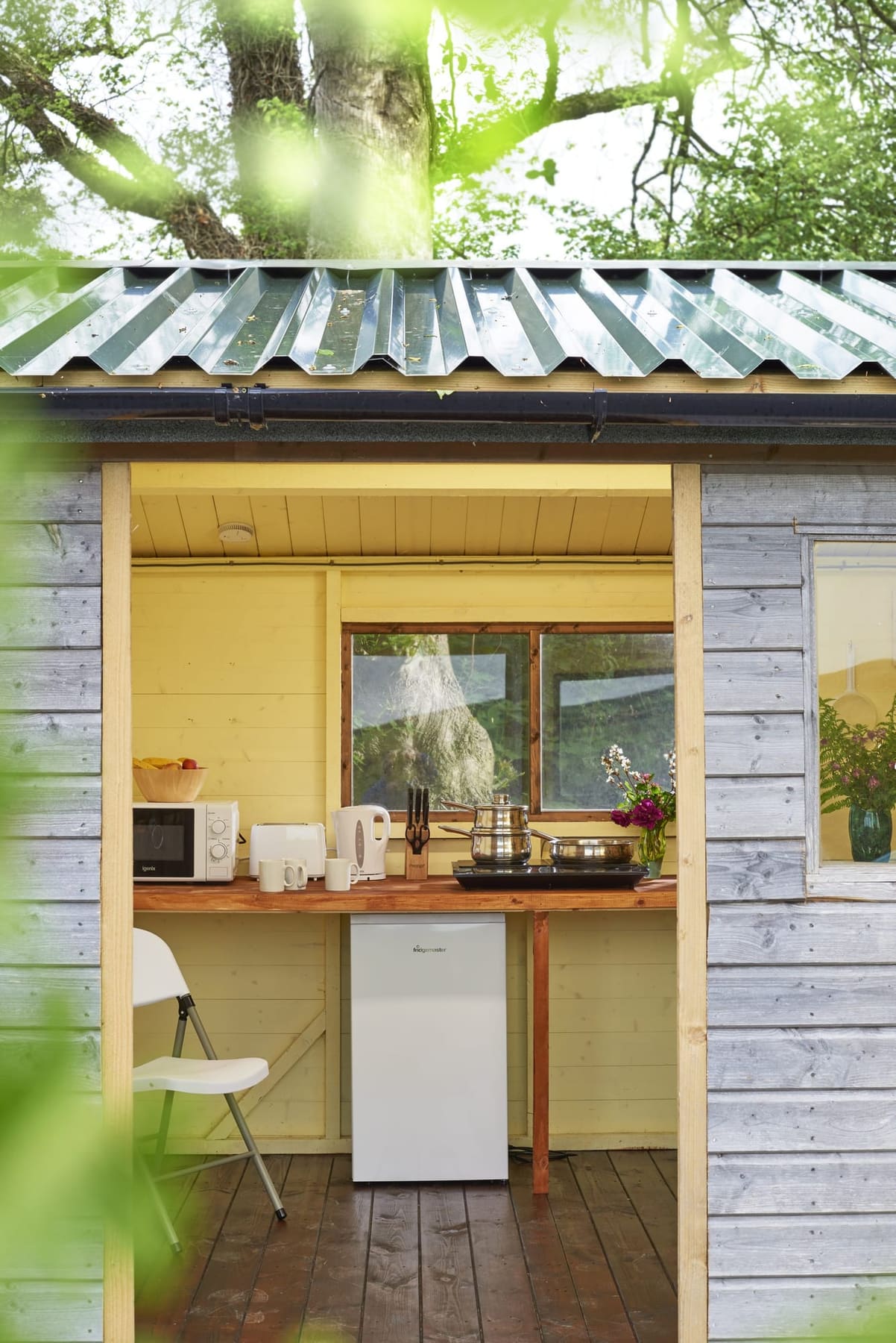 Private kitchen cabin at Fenton yurt set among the trees