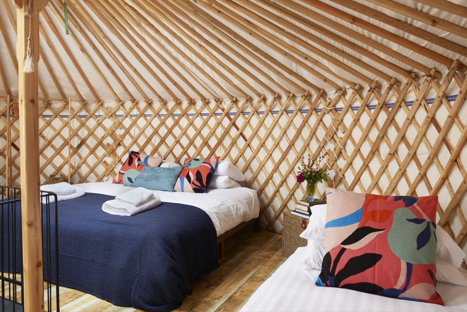 Fenton yurt super-king bed made up with luxury linen and cushions