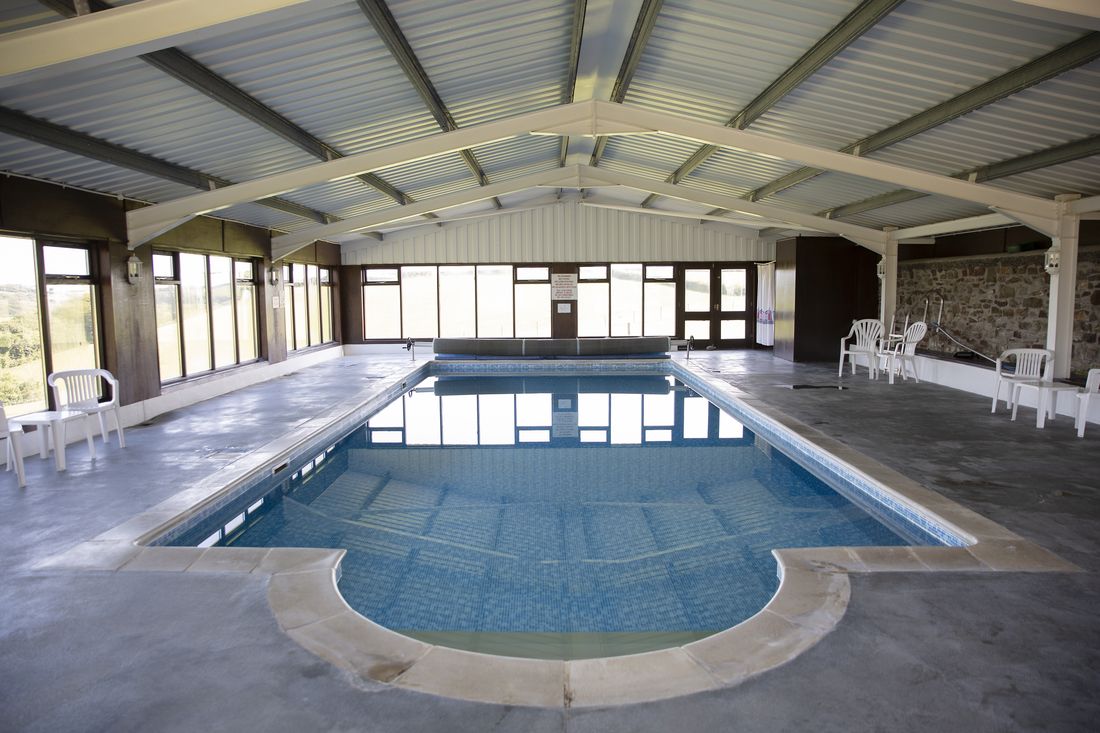 Heated indoor swimming pool at Woodlands Manor Farm
