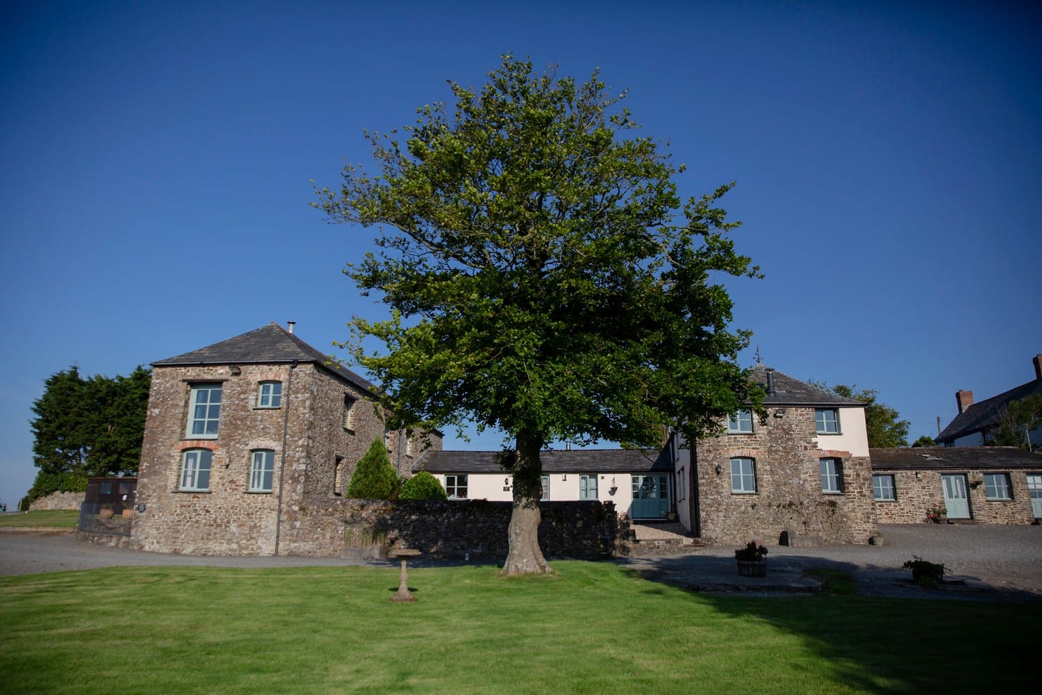 Woodlands Manor Farm courtyard and cottages in the sunshine, Bude Cornwall