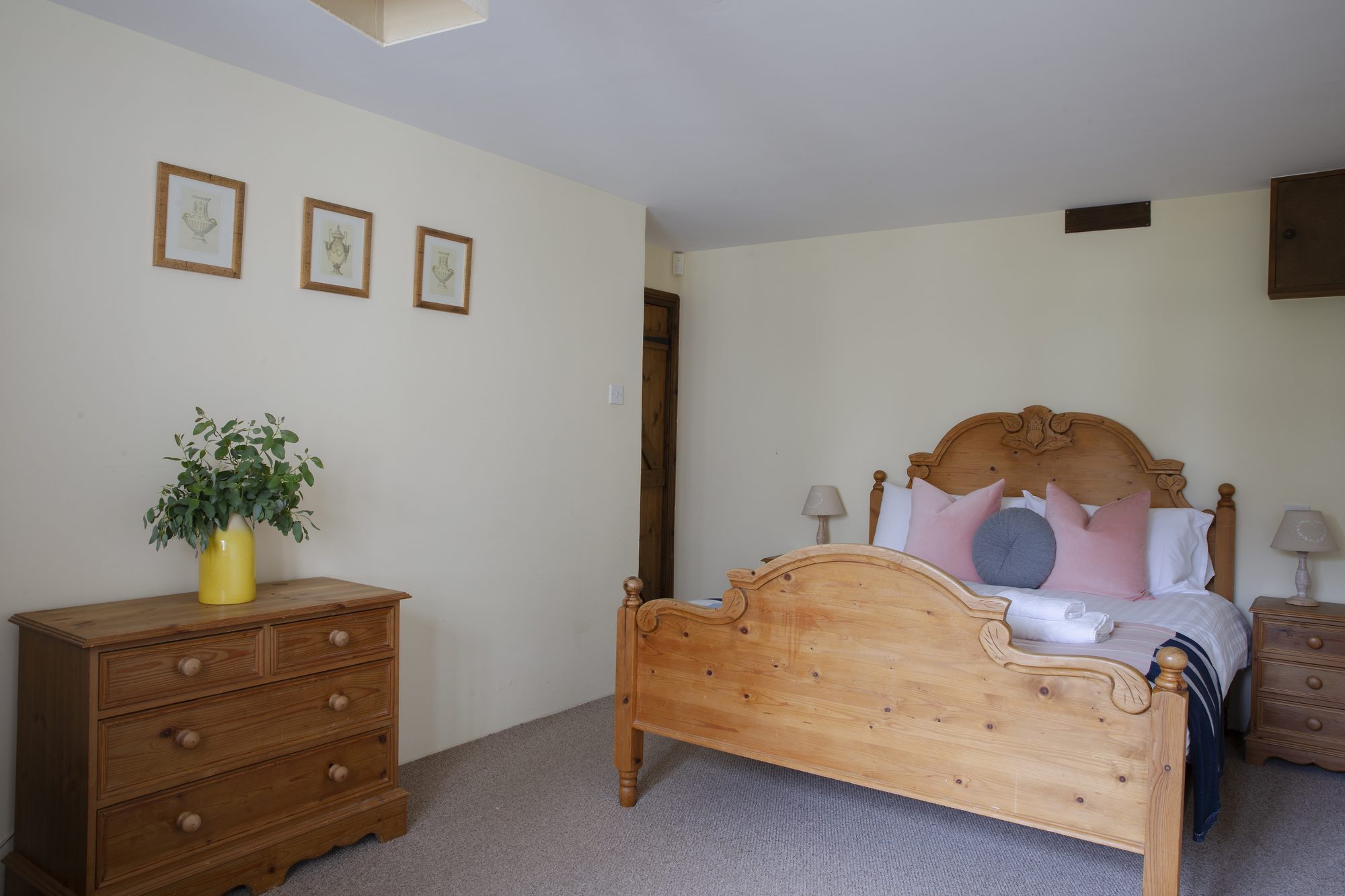 Bedroom at Honeysuckle Cottage with pine bed