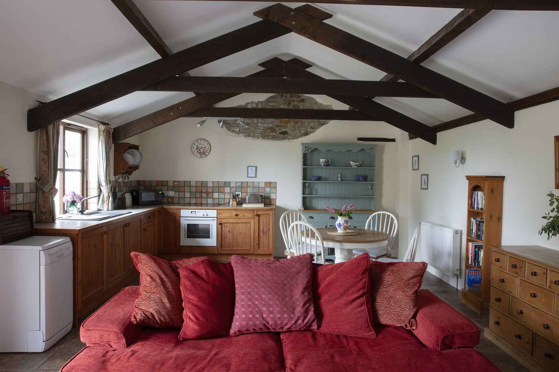 Honeysuckle Cottage kitchen with wooden units and open-plan lounge