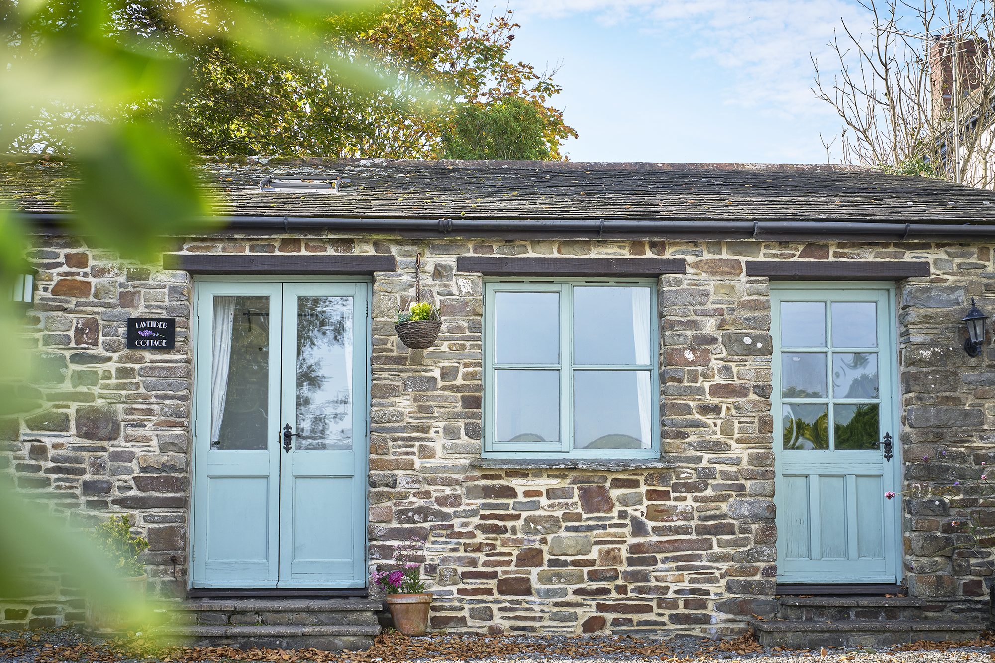 Lavender Cottage stone frontage with blue doors