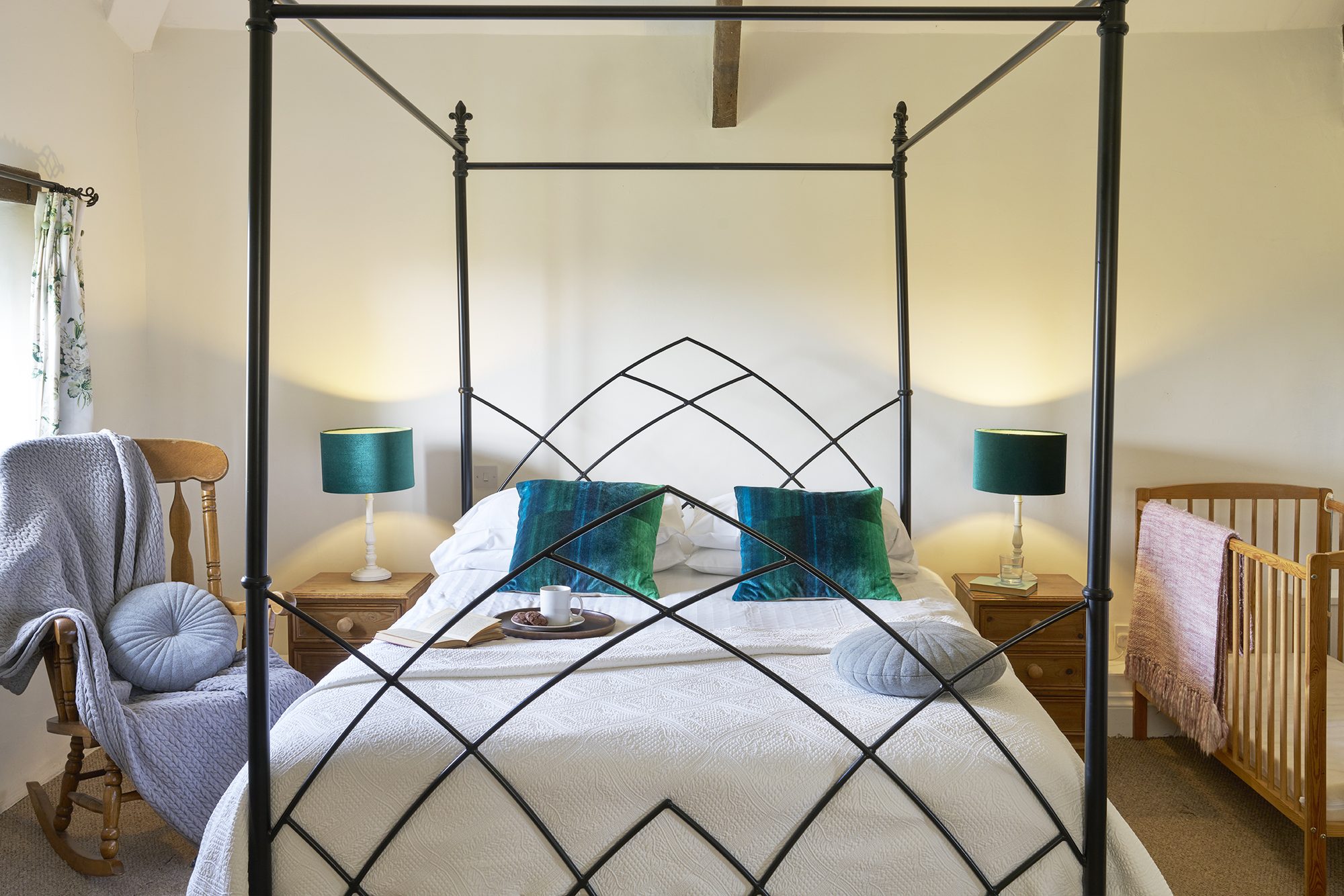 Double bedroom at Rose Cottage with four-poster bed