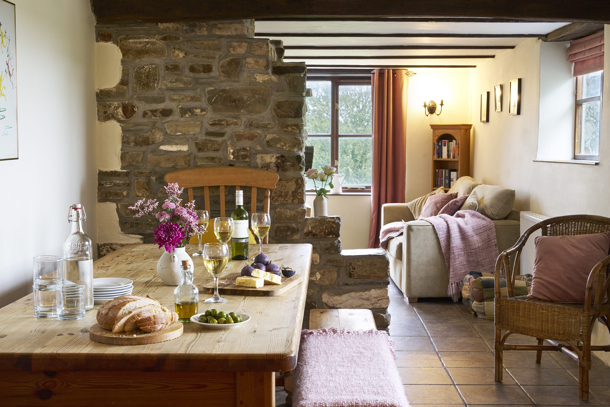 Rose Cottage dining area beside the stone fireplace