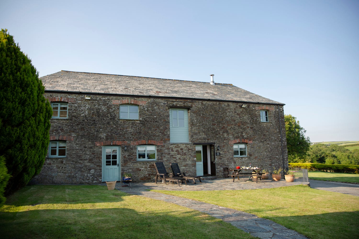 Rose Cottage exterior — converted stone barn at Woodlands Manor Farm, Bude