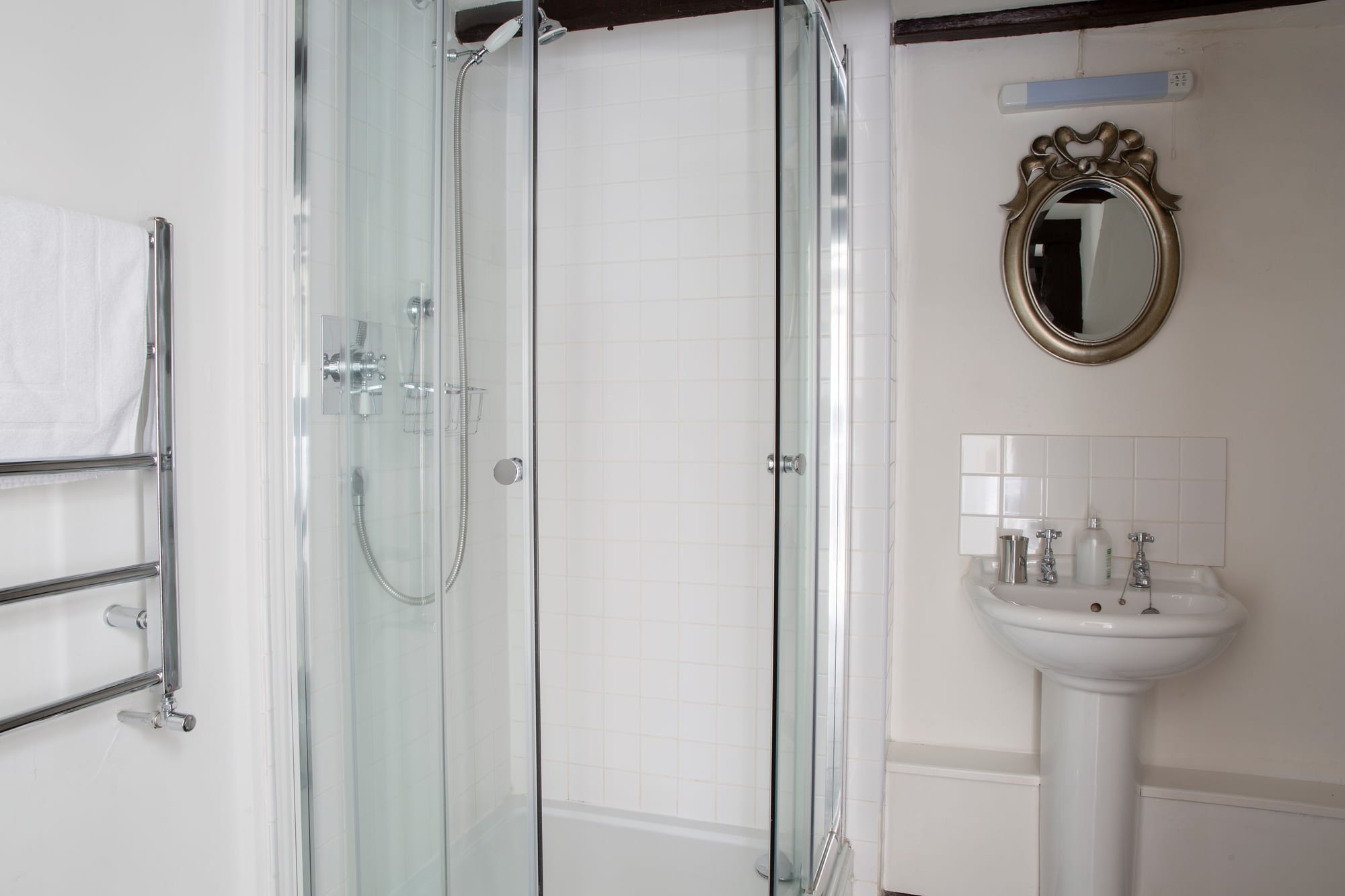 Coach House shower room with quadrant shower