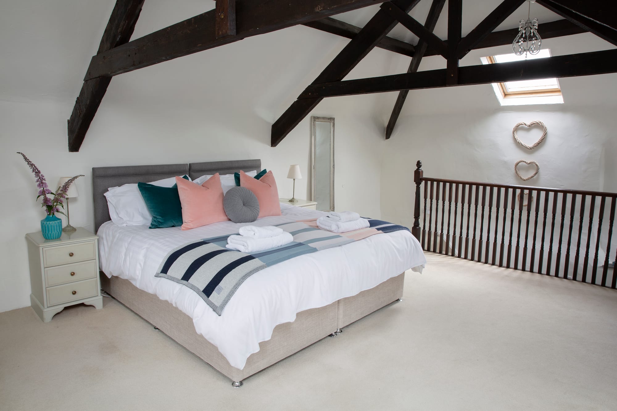 Coach House super-king bedroom with vaulted beams