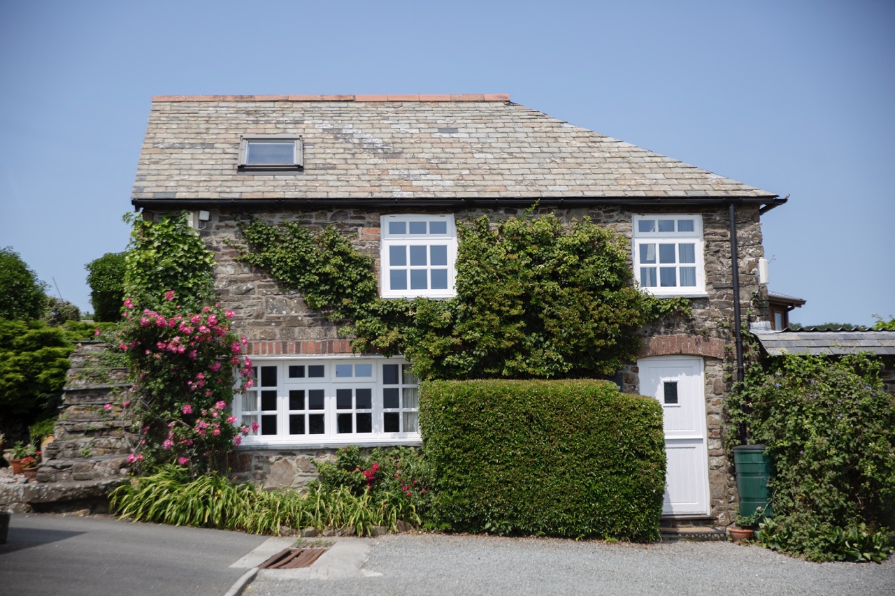 The Coach House — ivy-clad Cornish stone exterior