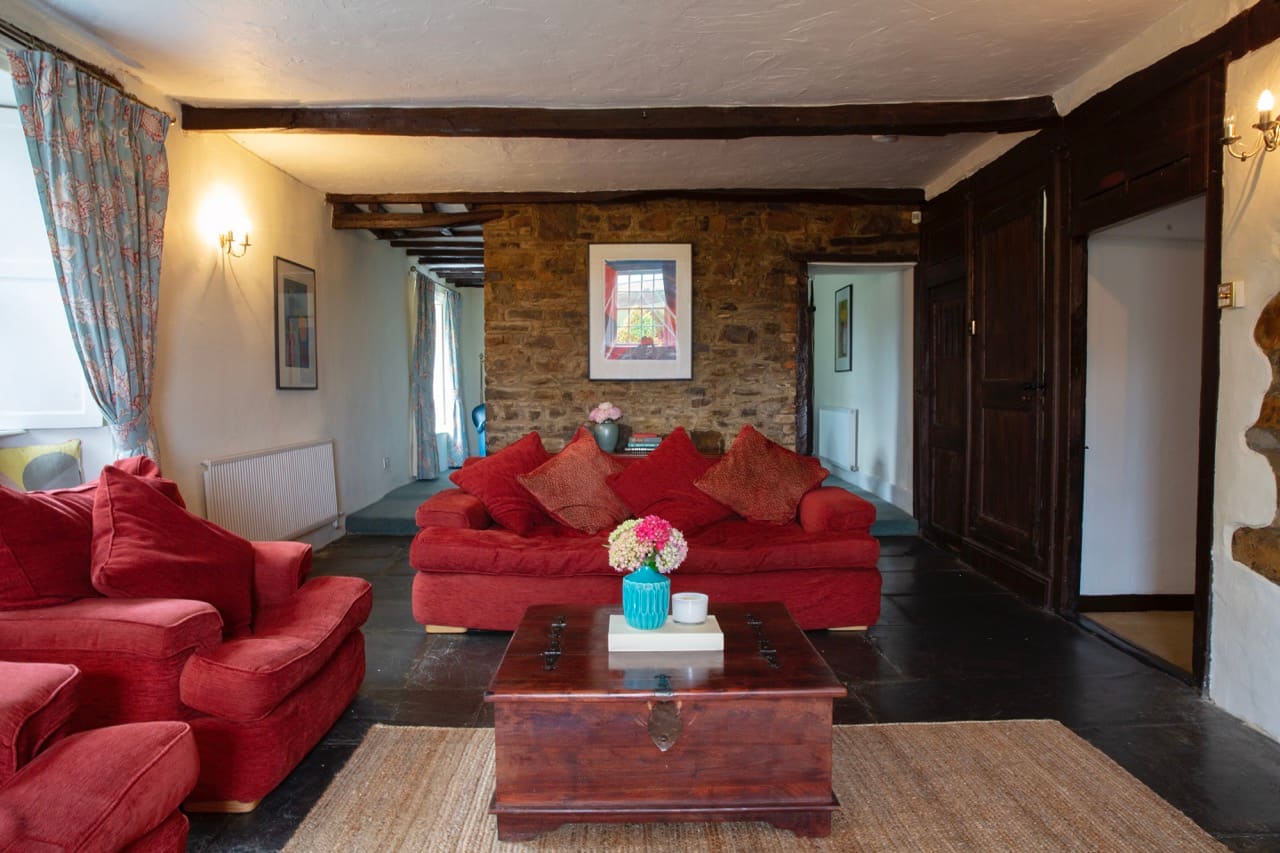 Manor House sitting room with stone fireplace