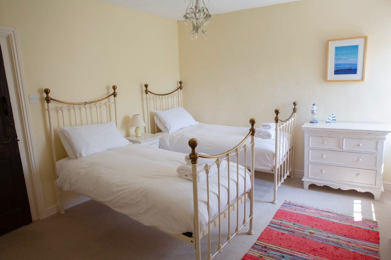 Twin bedroom with cast-iron bedsteads