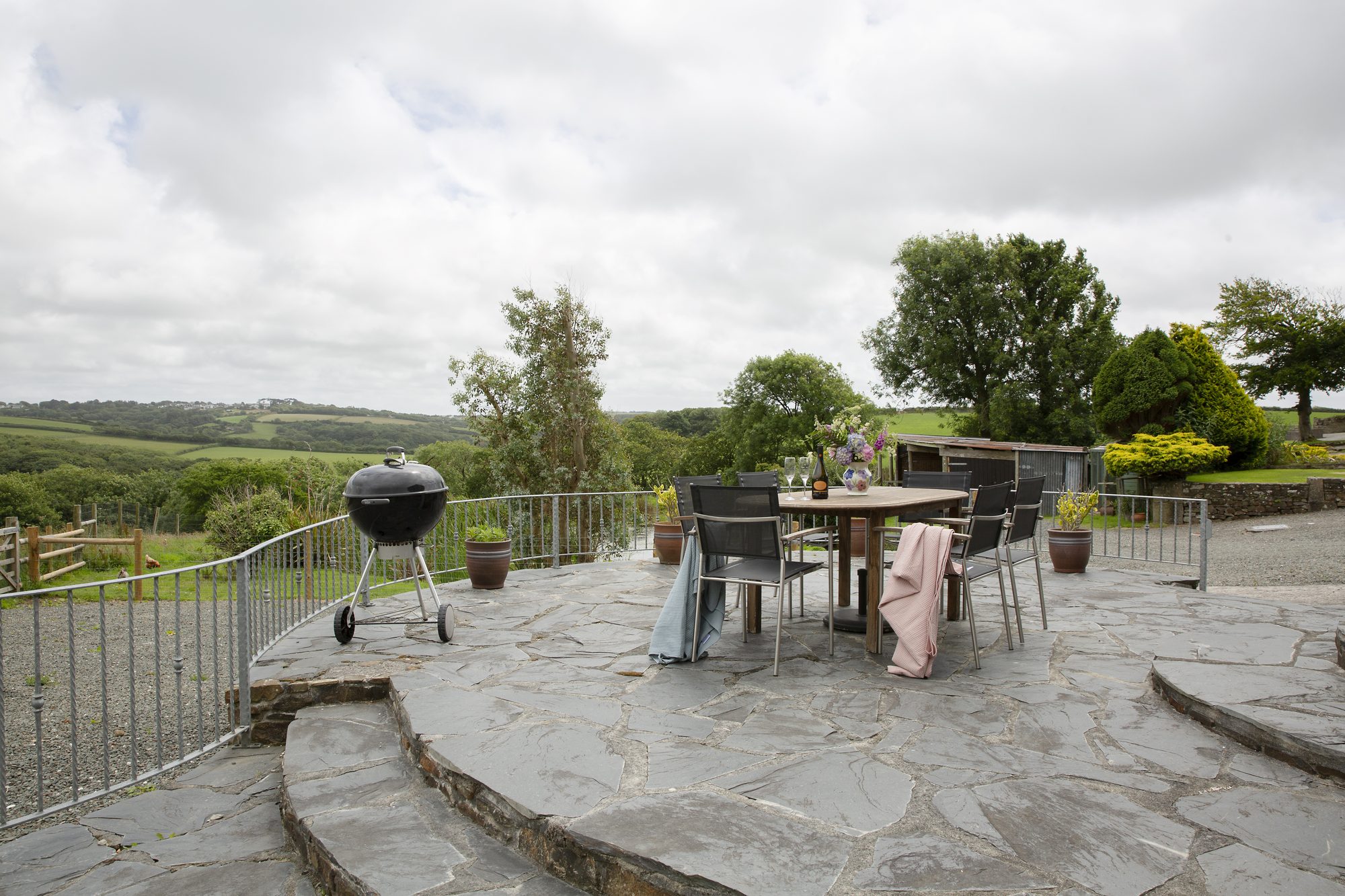 The Stables patio with dining and valley views
